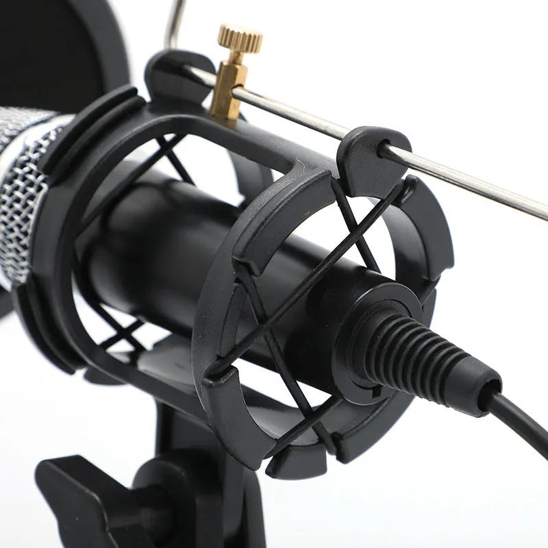 Black condenser microphone on adjustable aluminium stand with USB and 3.5mm cables for computer and mobile streaming