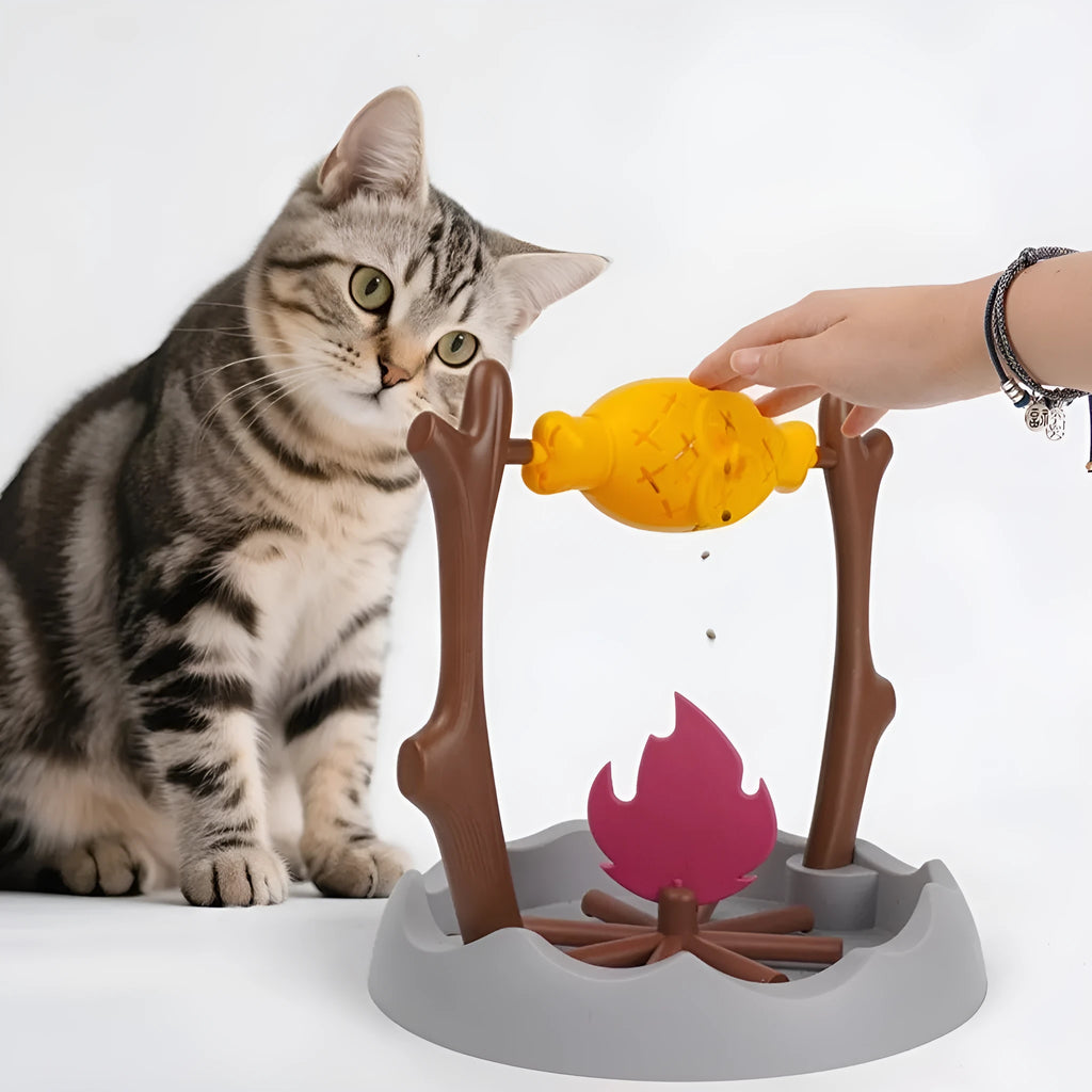 Barbecue-shaped tumbling cat toy with food dispenser, measuring 30x30x29 cm.