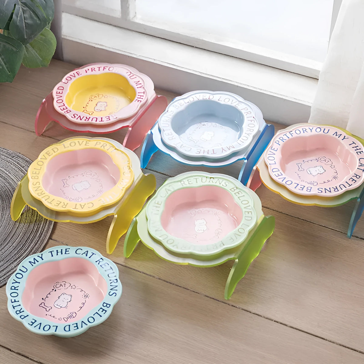Ceramic cat bowl with acrylic lace detail and anti-tumble neck in pink and blue colour options