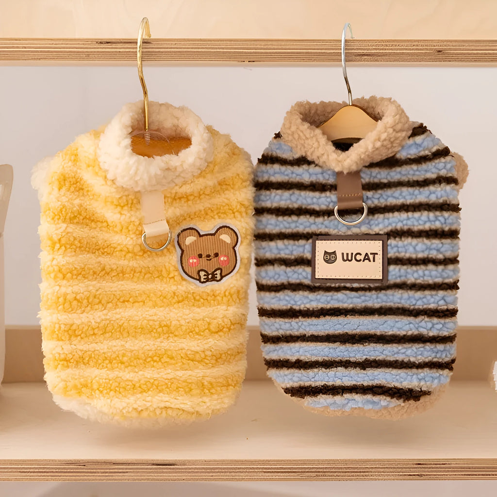 Yellow striped lambskin fleece dog clothing with bear patch and leash ring on a small dog