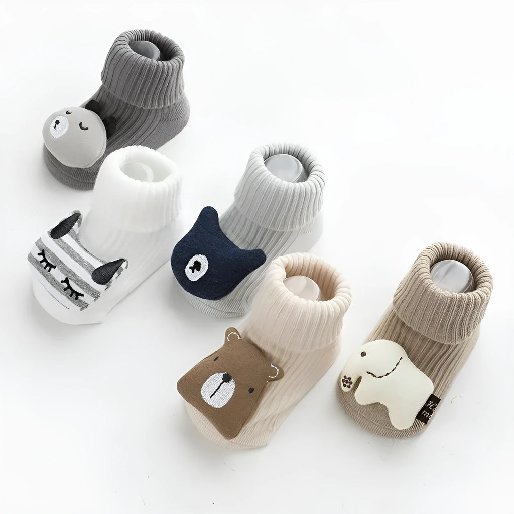 Baby socks with anti-slip dispensing glue in combed cotton, shown in multiple colours including blue bear print and pink cat.