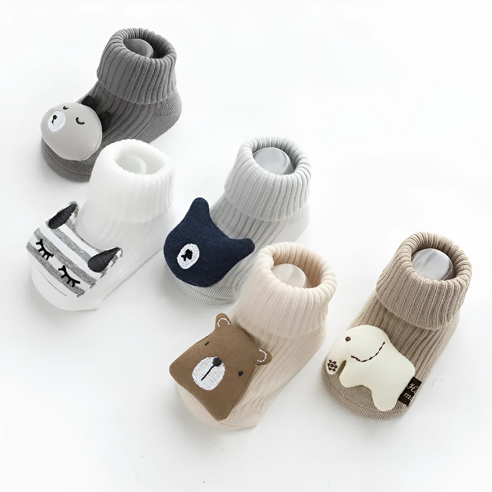 Baby socks with anti-slip dispensing glue in combed cotton, shown in multiple colours including blue bear print and pink cat.