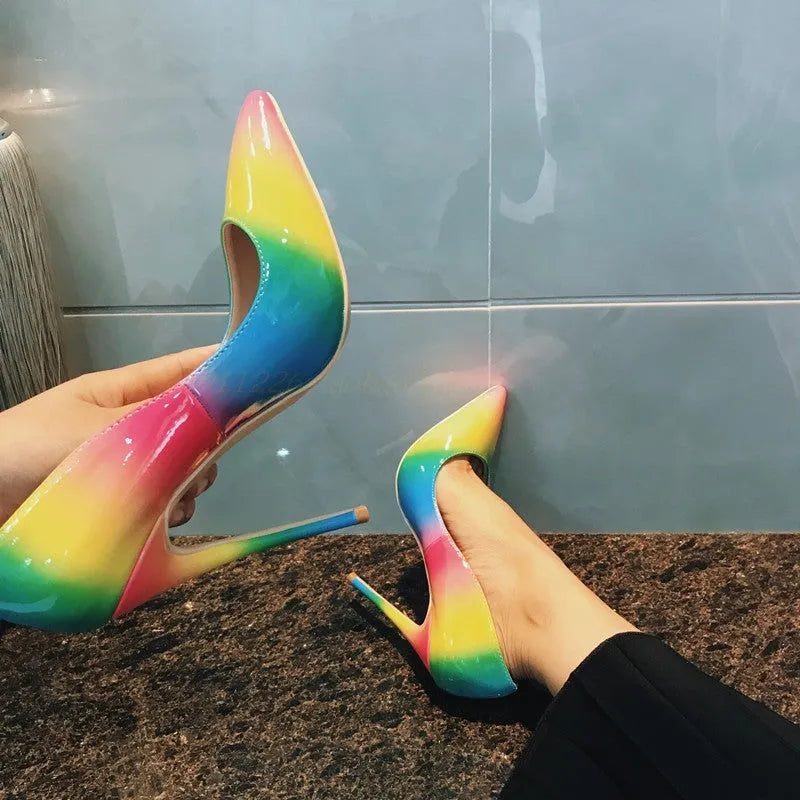 Rainbow glossy patent leather women's ultra-high heel shoes with a pointed toe and thin stiletto.