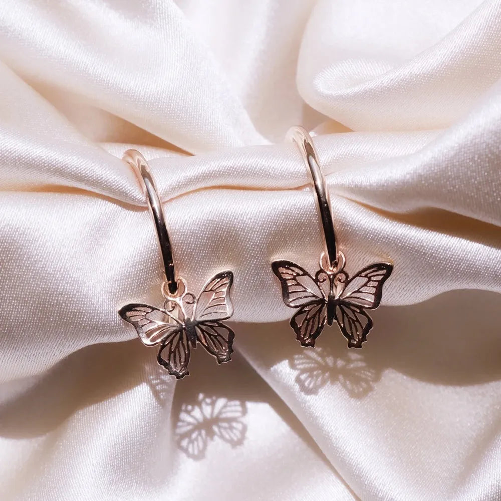 Gold and rose gold butterfly bow stud earrings, electroplated finish on copper alloy base