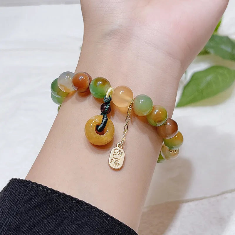 Yellow peacock agate bracelet with peace buckle clasp and old mine topaz stones