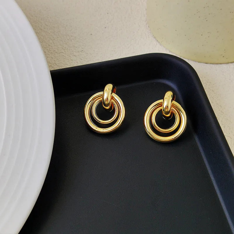 Geometric round ring earrings with irregular design in gold electroplated finish