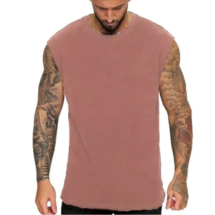 Men's loose cotton tank top in solid colours showing straight hem design and sleeveless cut