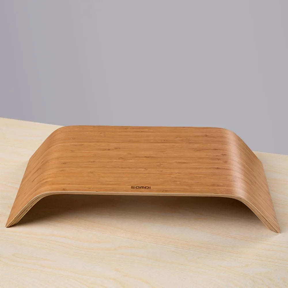 Walnut laptop stand with stability bracket in bamboo leather colour on a desk
