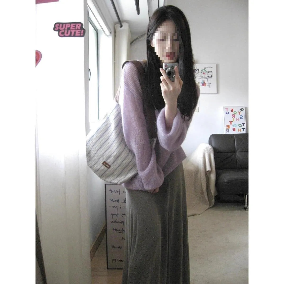 Purple sleeveless women's blouse with princess sleeves and a shoulder strap detail.