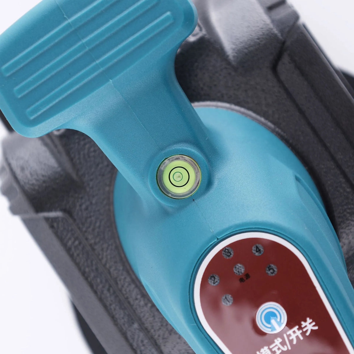 Household electric ceramic tile tiling machine with lithium battery and two batteries on work surface