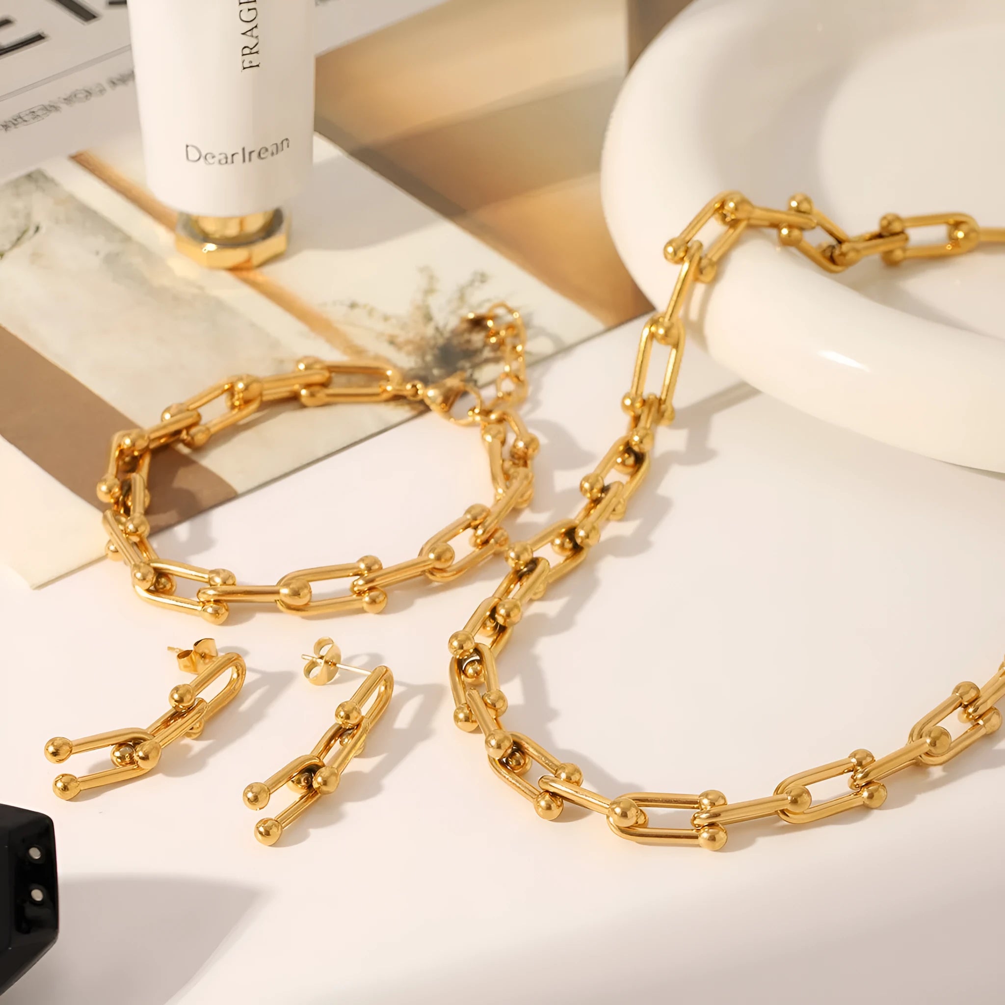 Stainless steel horseshoe jewellery set with necklace, bracelet, and earrings featuring titanium steel pendants