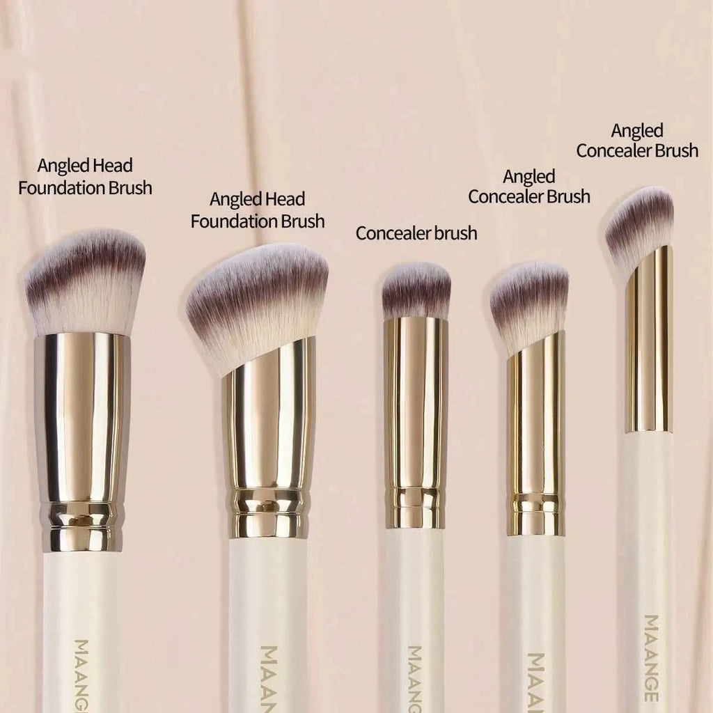 MAANGE apricot-coloured angled blush brush and four other makeup brushes on a table.