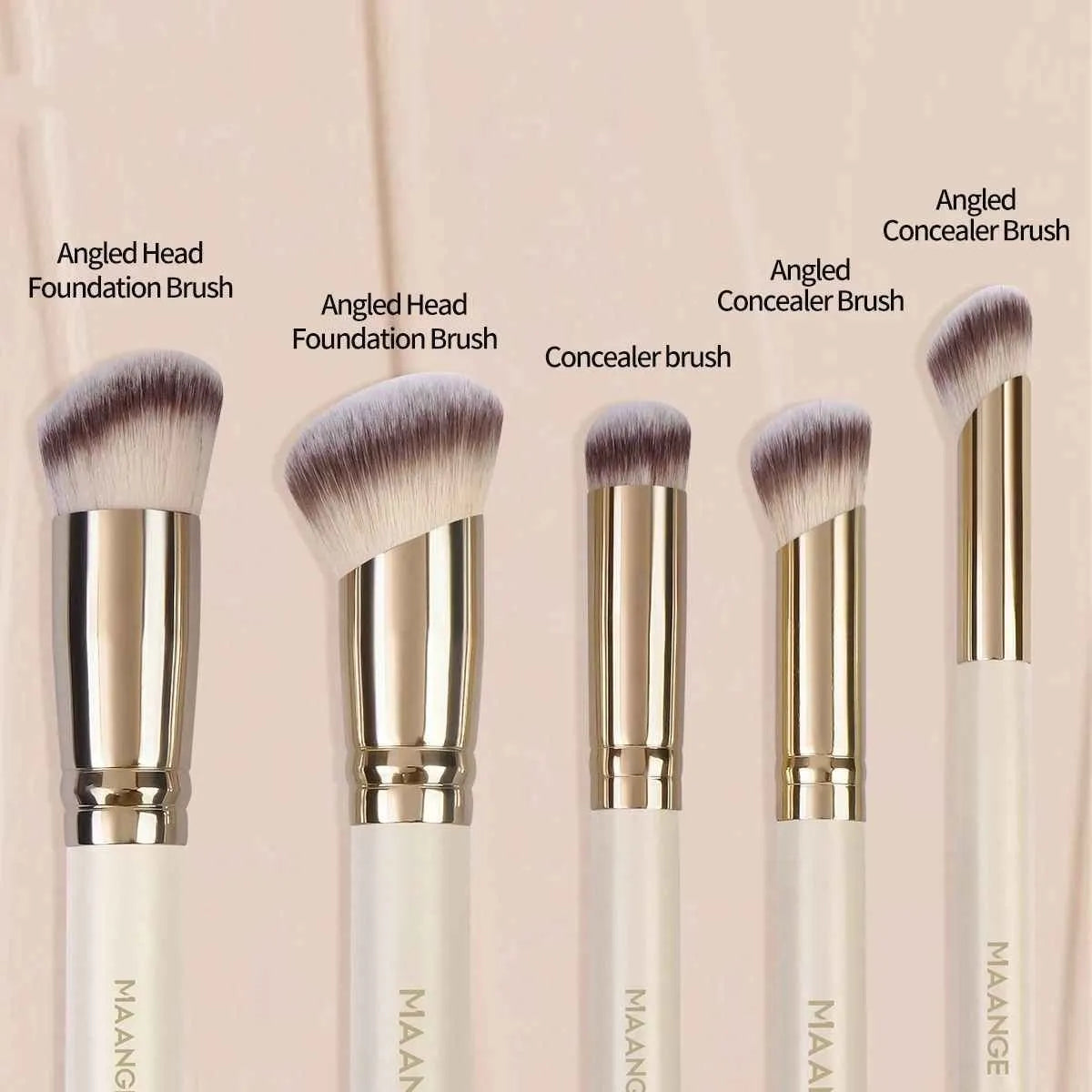 MAANGE apricot-coloured angled blush brush and four other makeup brushes on a table.