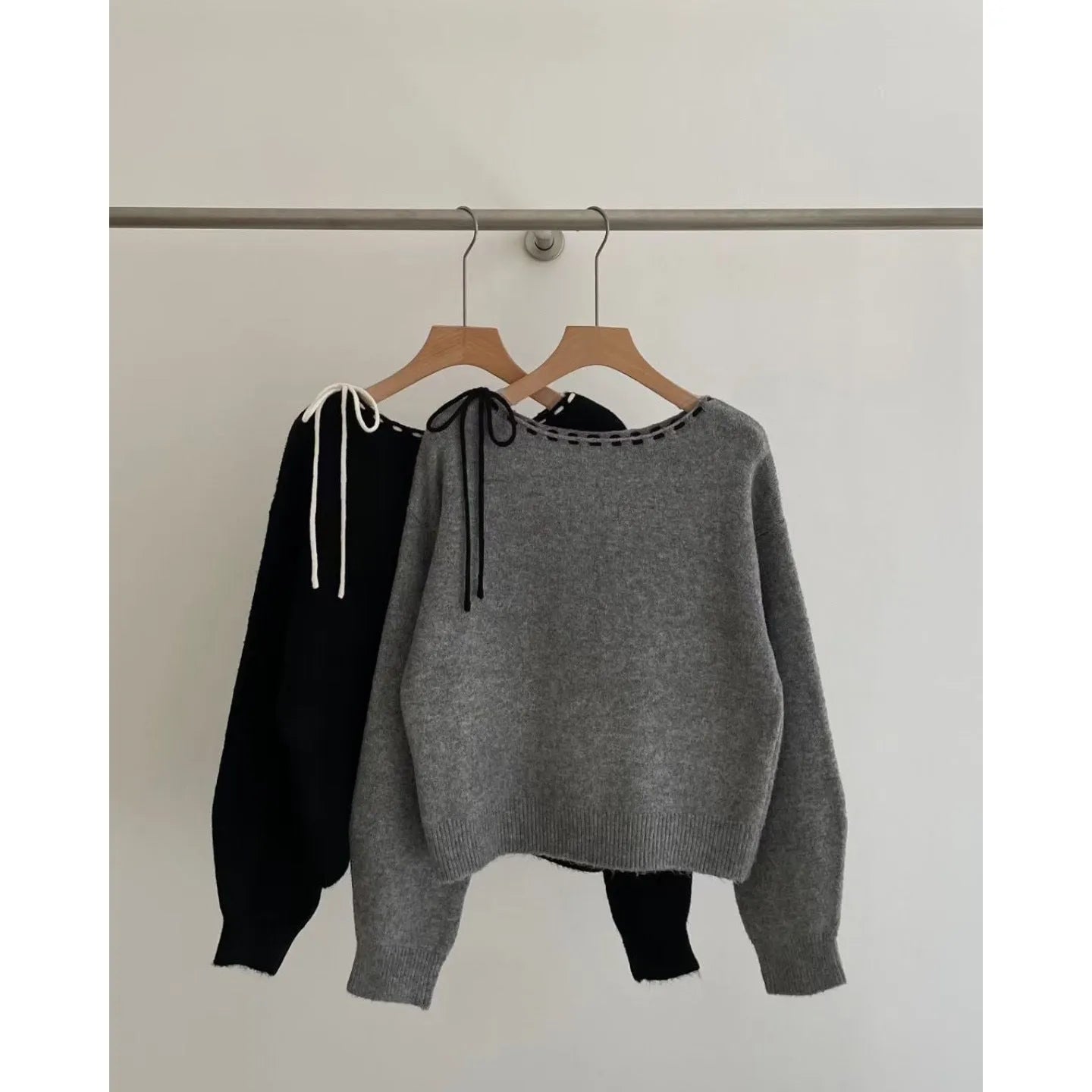 Women's loose-fitting black knitwear pullover jumper made from regenerated cellulose fibre.