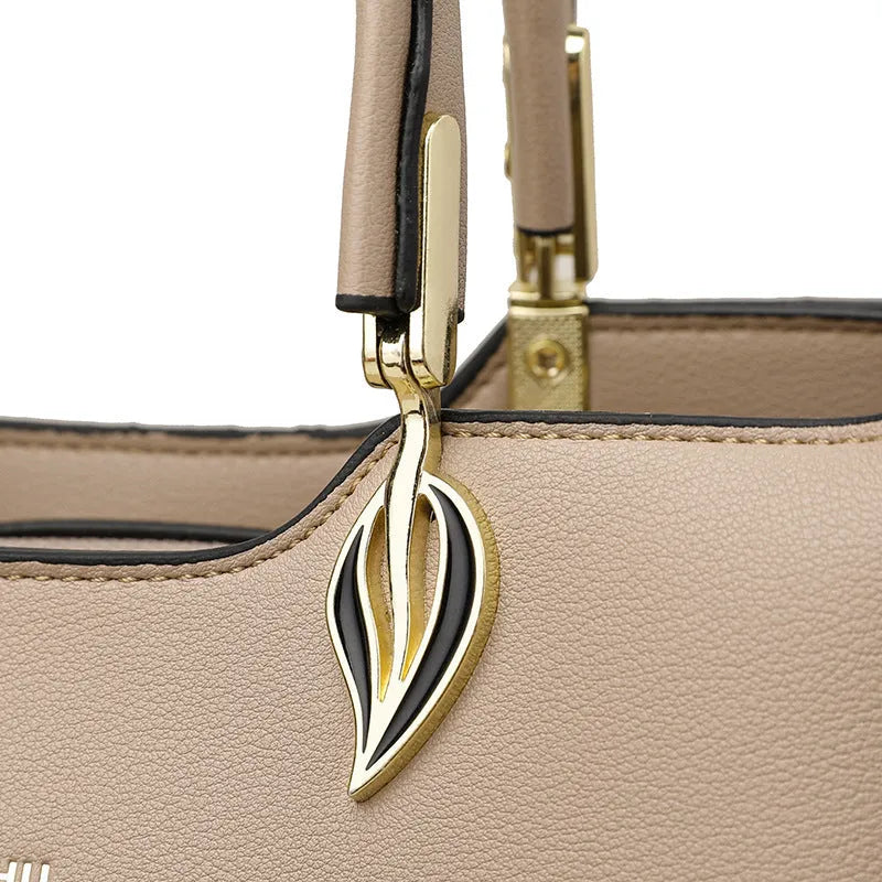 Women's black PU leather messenger bag with shoulder strap and sewing thread detail.