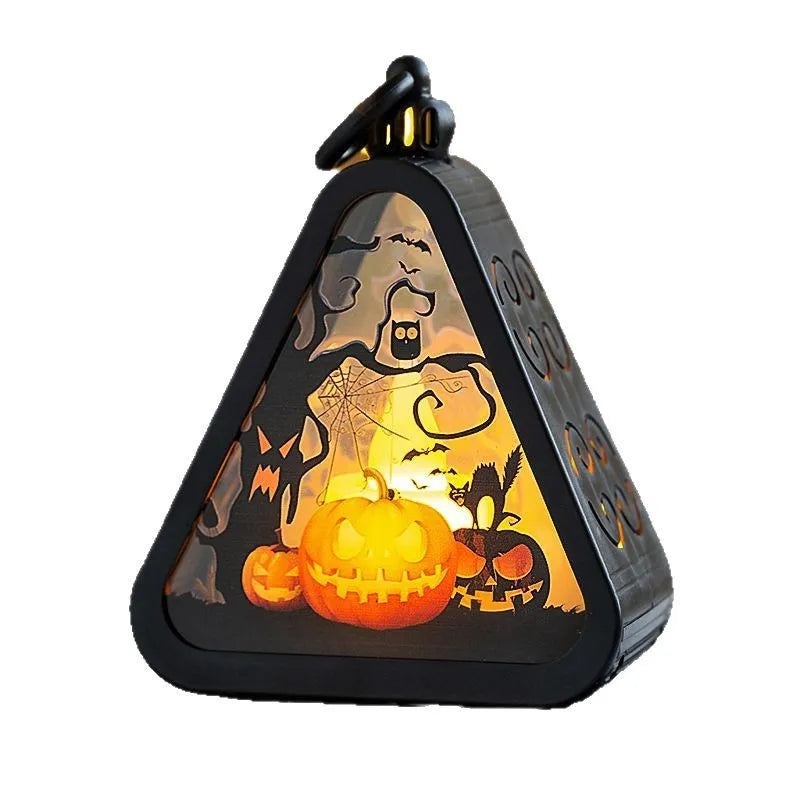 A Halloween decoration pumpkin lamp prop in plastic and glass, showing one of the four colour design options.