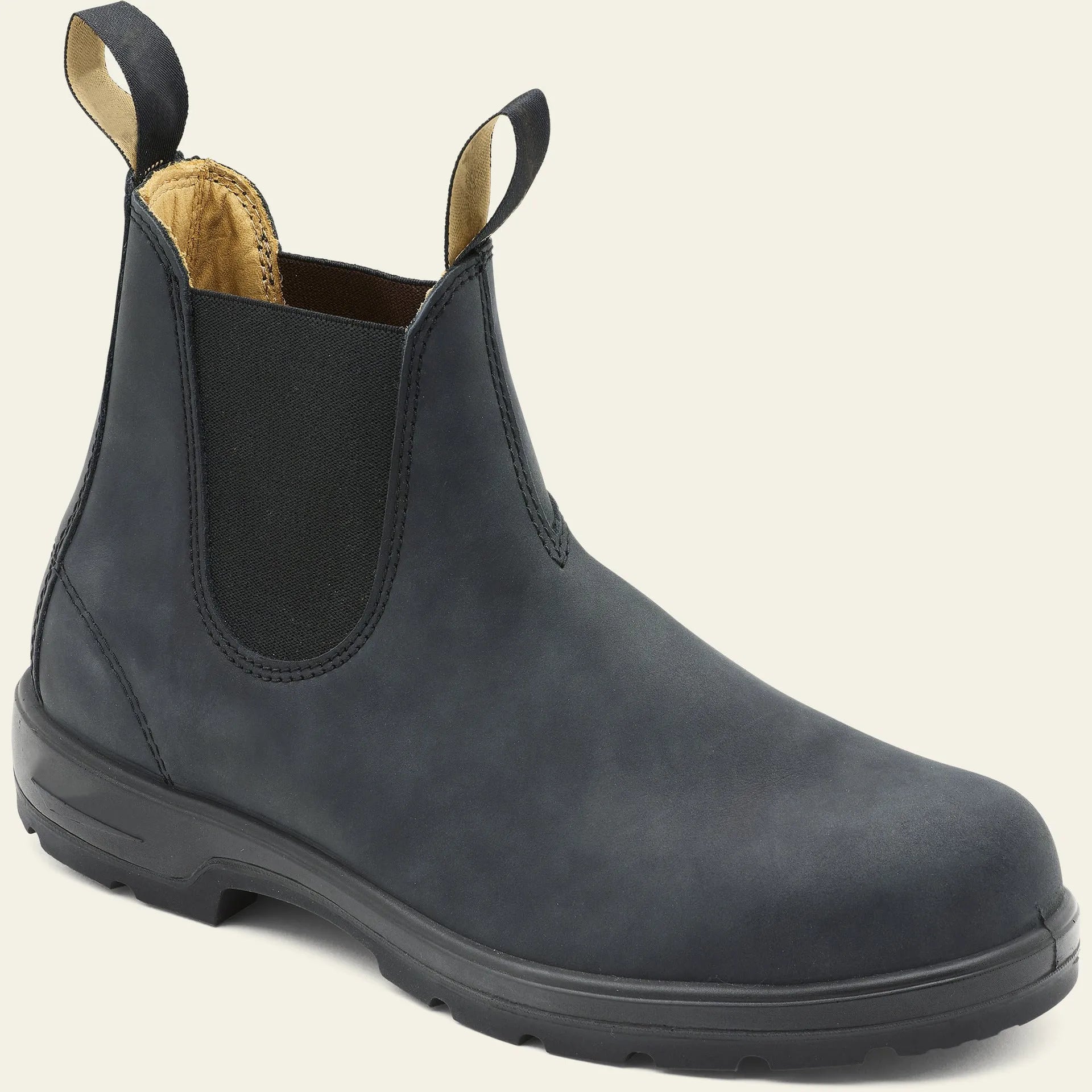 Vintage brown unisex Chelsea boots with car stitching and a low horse hoof heel.