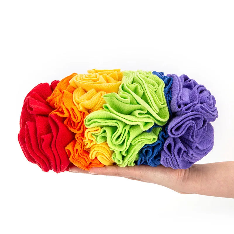 Dog snuffle pad in rainbow colour with polar fleece strips on a light background, 25x15cm size