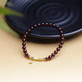 Single ring bamboo joint bracelet with 6mm natural garnet bead in copper or silver finish