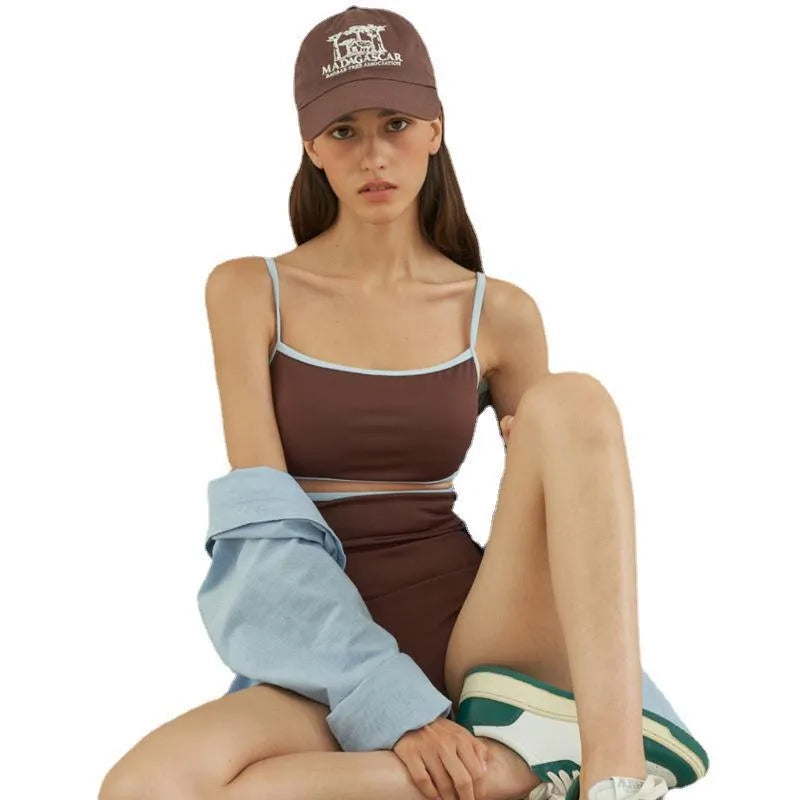 Brown women's triangle top one-piece swimsuit on hanger showing front design