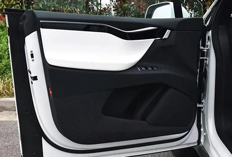 Clear carbon fibre protective film kit for Tesla Model S car door interior panels.