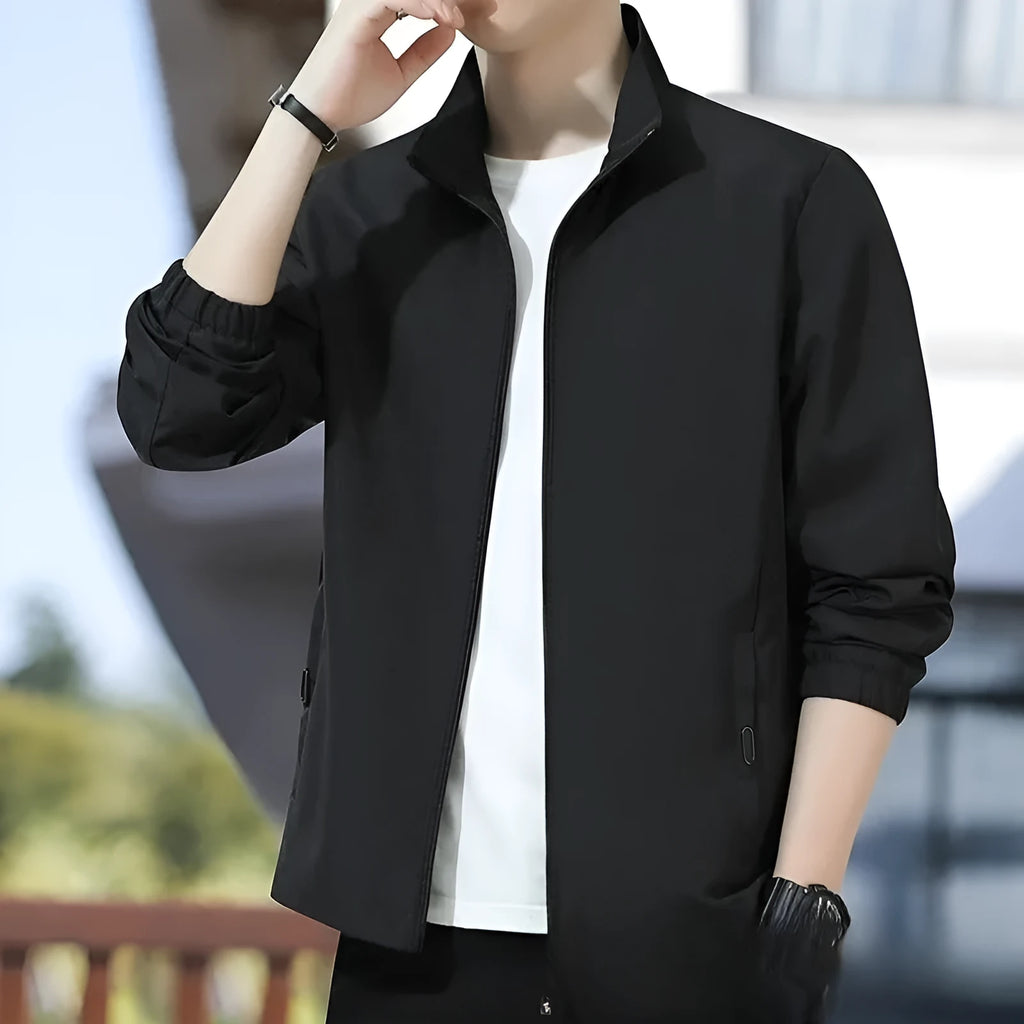 Man wearing a thin, loose lapel Korean-style casual jacket in a neutral colour.