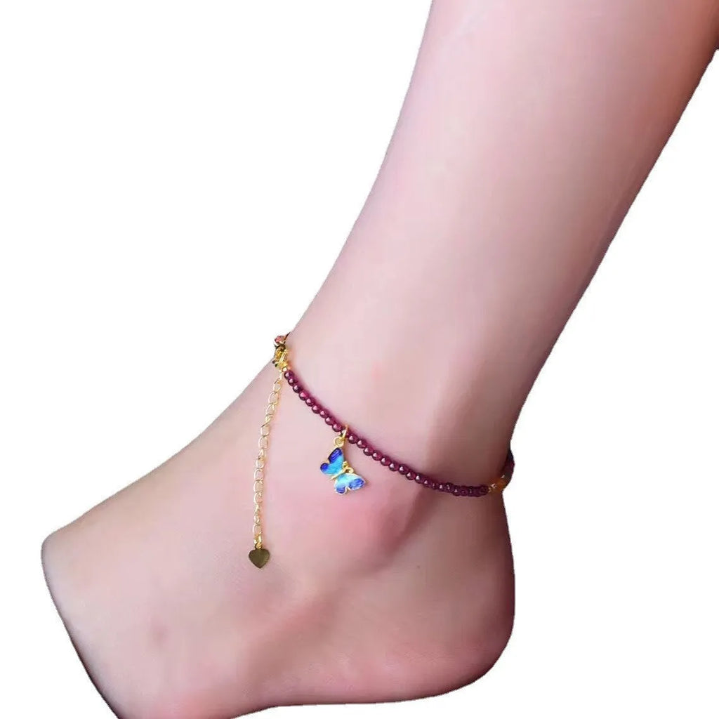 Purple garnet stone bead geometric anklet on an adjustable metal chain.