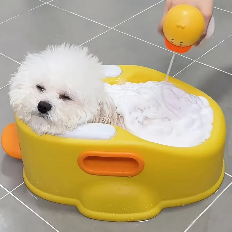 Blue PVC duck-shaped bathtub for washing small dogs and cats on a bathroom floor.