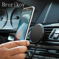 Qi wireless car charger with magnetic stand clamped to a car air vent