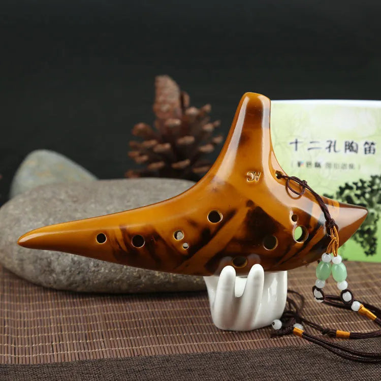 Yellow 12-hole ceramic ocarina in Alto C with 13-note C major range, integrated lanyard, bag and cable