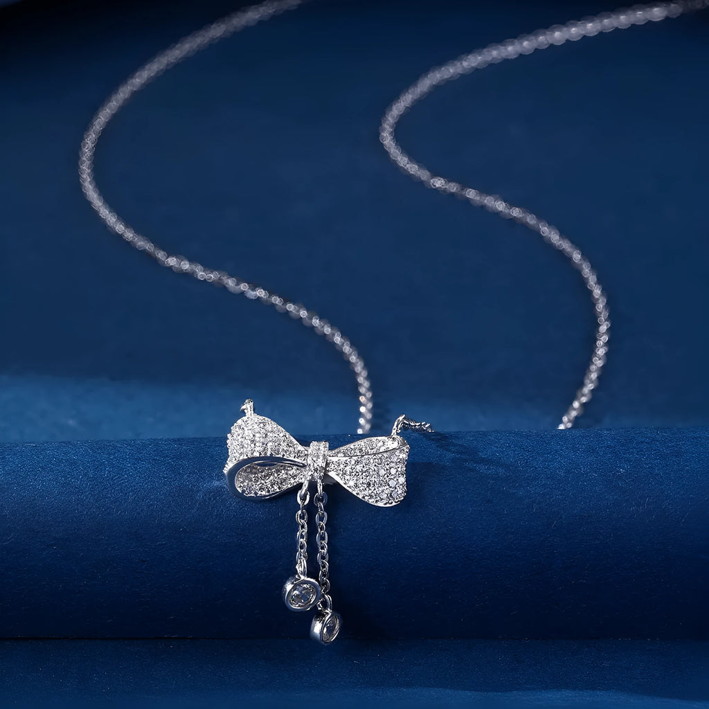 Sterling silver bow necklace with adjustable 40-45cm chain and O-ring design