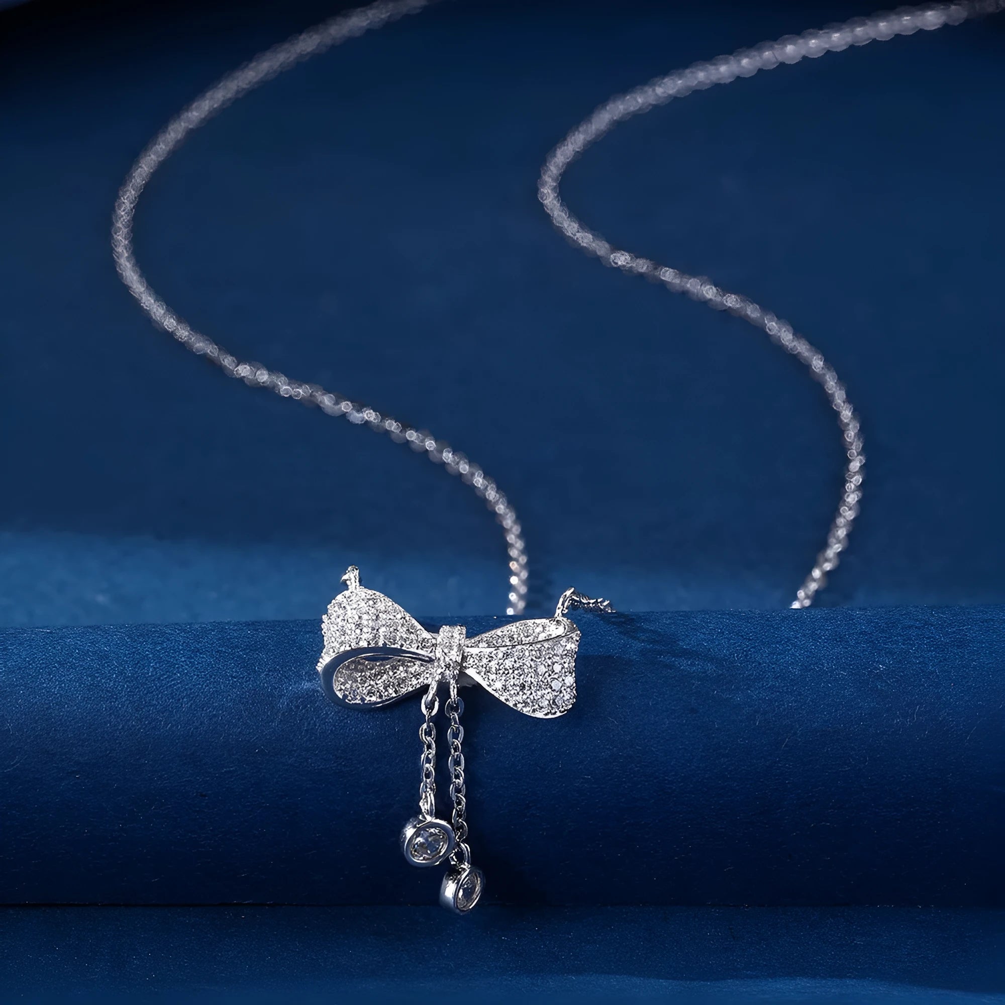 Sterling silver bow necklace with adjustable 40-45cm chain and O-ring design