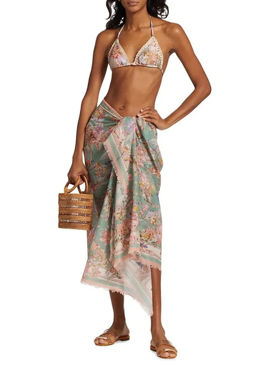 Women's creamy-white floral bikini set with matching skirt bottom