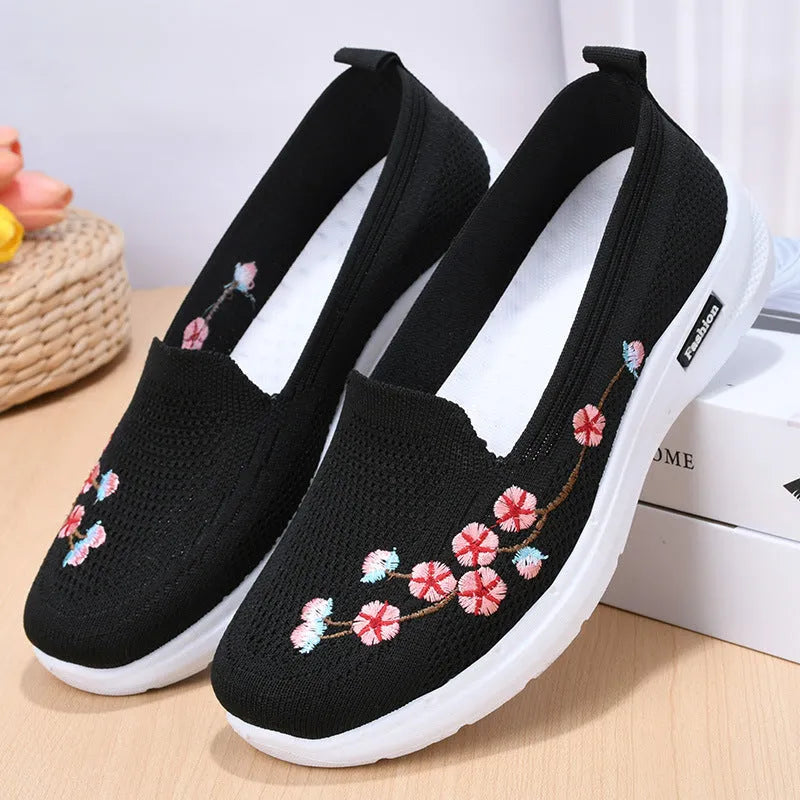 Women's wine red embroidered floral woven pumps with a flat anti-slip sole.