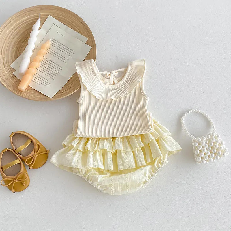 Beige cotton girls summer set with sleeveless ruffled collar top and double-layer bud-waisted shorts