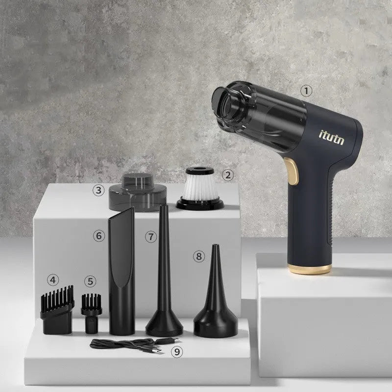 Black wireless handheld car vacuum cleaner with multiple nozzle attachments on charging cable