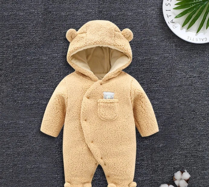 Brown cotton baby winter jumpsuit with covered feet and a front zipper.