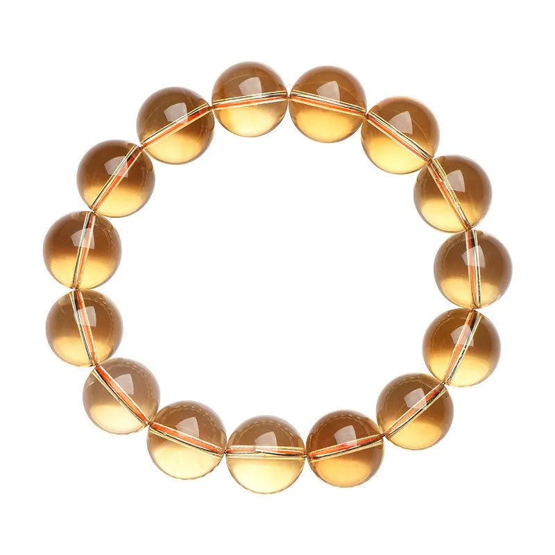Natural citrine scattered beads ball bracelet in 7A and 6A colour grades on a wrist.