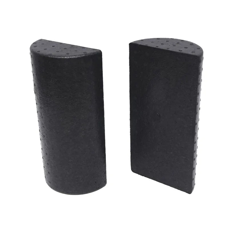 Black semi-circular EPP foam yoga roller 30cm on floor for muscle massage and stretching