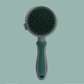 Green and pink double-sided cat brush with release button and included flea comb for pet grooming