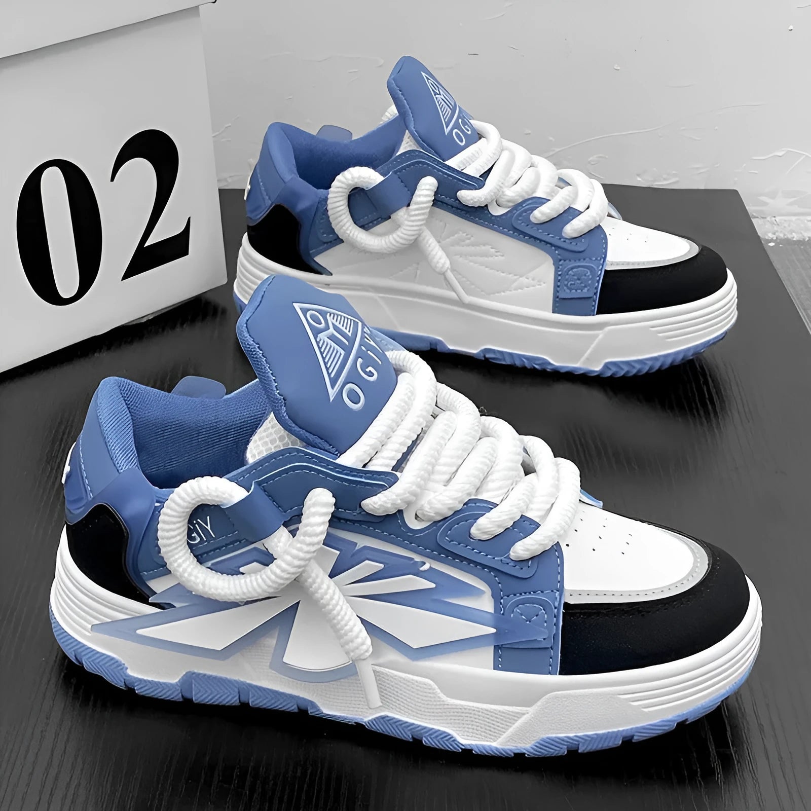 Men's white chunky sneakers with a cartoon pattern, round toe, and thick rubber sole on a plain background.