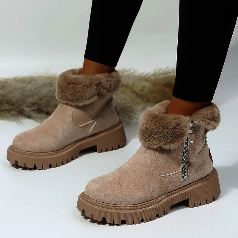 Women's black faux suede high-top snow boots with side zip and thick faux fur lining visible at the ankle.