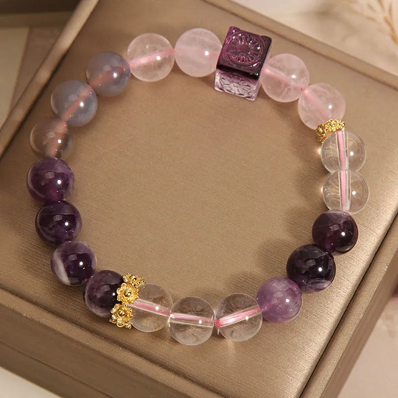 Purple natural amethyst crystal bracelet with rhinestone elements on adjustable band