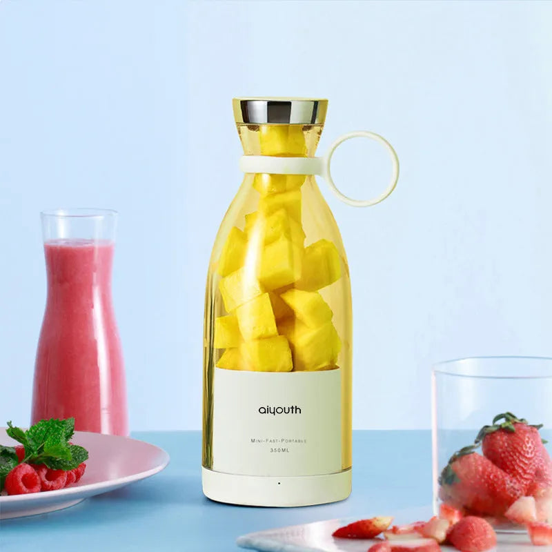 Pink and white handheld electric juicer with USB charging port