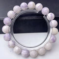 Close-up of a women's bracelet with natural purple turquoise beads on a wrist.