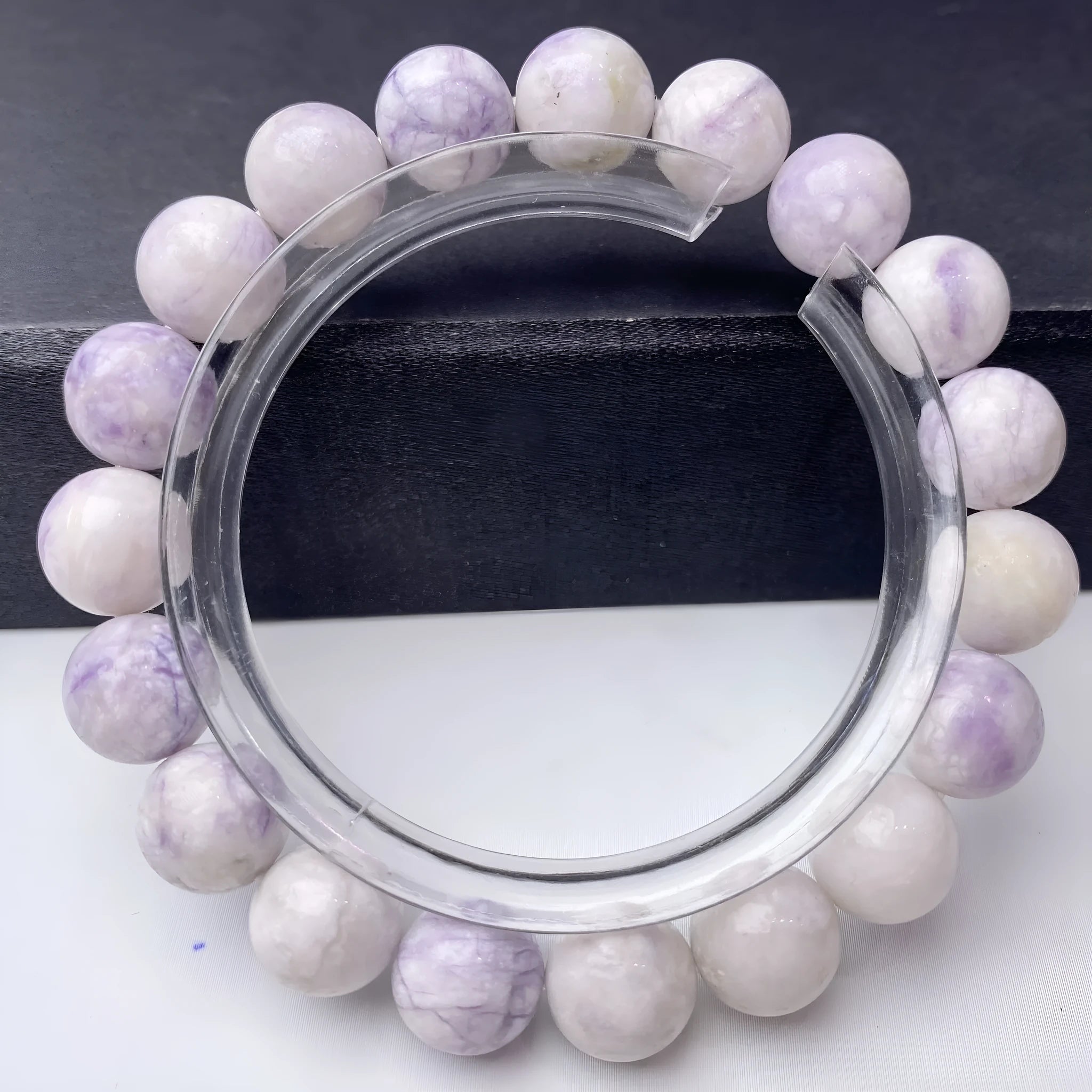 Close-up of a women's bracelet with natural purple turquoise beads on a wrist.