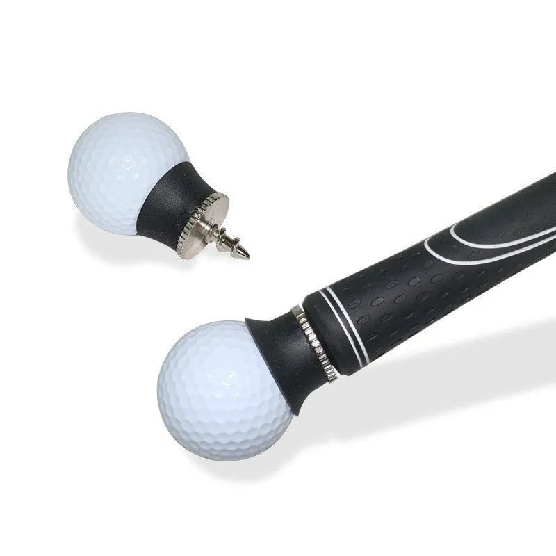 Black TPR golf ball suction cup picker with conventional size on a green surface