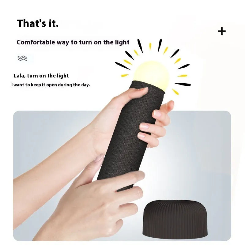 Handheld LED night light with fabric cover and base, warm light, black or pink, 92 x 193mm
