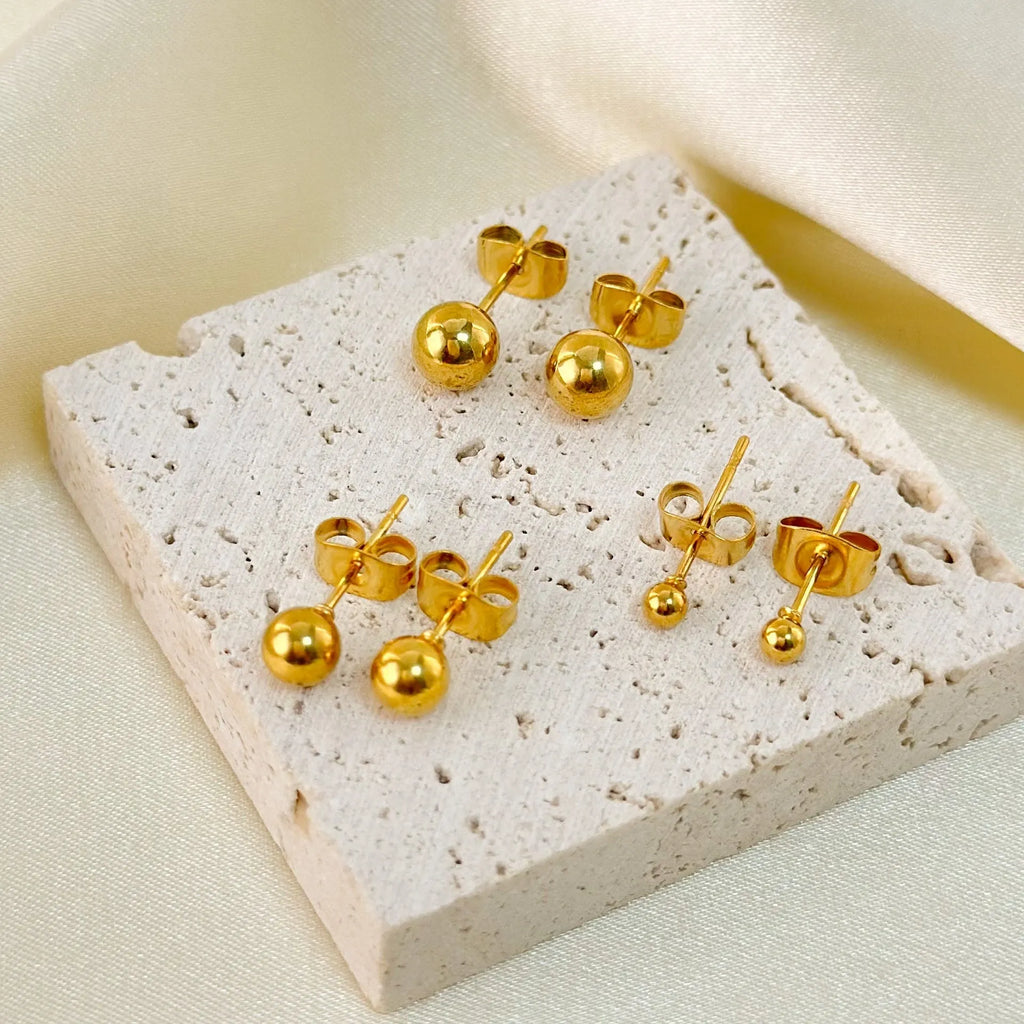 Titanium steel ball stud earrings with round geometric design in gold and silver electroplated finishes