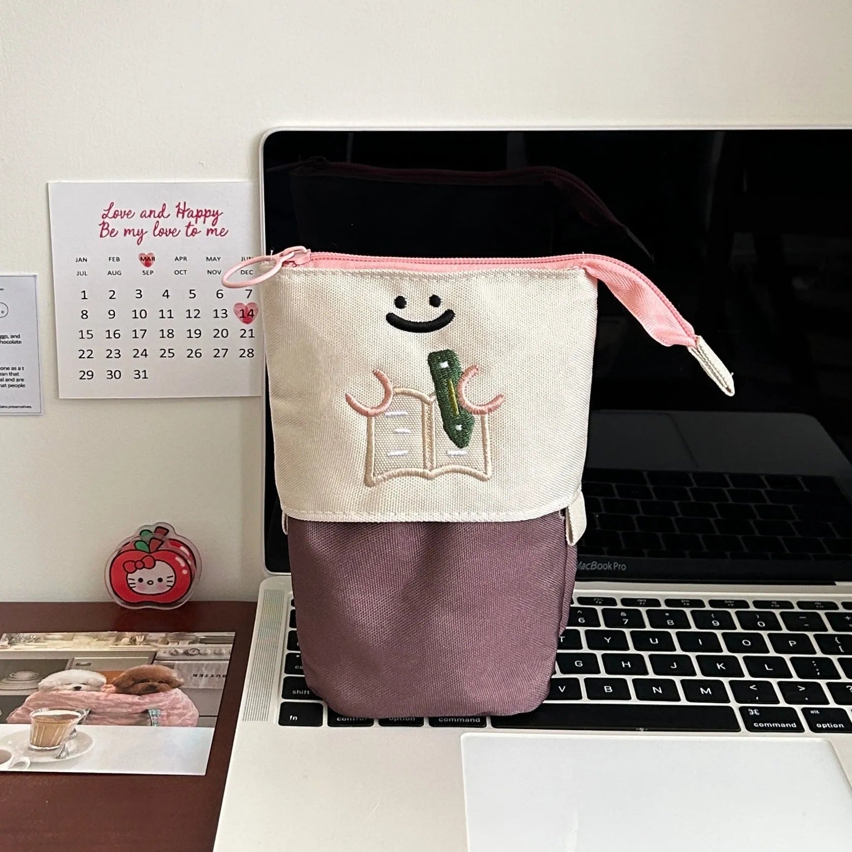 Brown collapsible cartoon design pencil case made from Oxford fabric, shown with zip open.